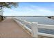 Scenic waterfront sidewalk with brick pavers and a white concrete railing overlooking the water at 1600 1St W Ave # 304A, Bradenton, FL 34205