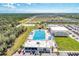 Aerial view of community pool, playground, and surrounding neighborhood at 16257 S Port Harbor Blvd, Port Charlotte, FL 33953
