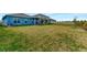 Spacious backyard with grassy area at 16257 S Port Harbor Blvd, Port Charlotte, FL 33953