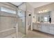 Bathroom with double vanity, large walk-in shower, and separate toilet at 16257 S Port Harbor Blvd, Port Charlotte, FL 33953