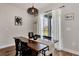 Farmhouse style dining room with wooden table and sliding glass doors at 16257 S Port Harbor Blvd, Port Charlotte, FL 33953