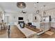 Dining room features a long wooden table and views into kitchen and living room at 16257 S Port Harbor Blvd, Port Charlotte, FL 33953