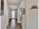 Long hallway with light walls and hardwood floors at 16257 S Port Harbor Blvd, Port Charlotte, FL 33953
