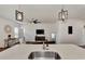 Modern kitchen island with sink, breakfast bar, and stainless steel appliances at 16257 S Port Harbor Blvd, Port Charlotte, FL 33953
