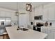 Modern kitchen with island, stainless steel appliances, and pendant lighting at 16257 S Port Harbor Blvd, Port Charlotte, FL 33953