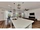 Kitchen island with sink and breakfast bar, open to dining area at 16257 S Port Harbor Blvd, Port Charlotte, FL 33953