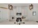 Modern kitchen with white cabinets, stainless steel appliances, and an island at 16257 S Port Harbor Blvd, Port Charlotte, FL 33953
