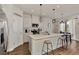 Modern kitchen with white cabinets, stainless steel appliances and an island at 16257 S Port Harbor Blvd, Port Charlotte, FL 33953
