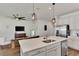Open concept kitchen with stainless steel appliances and an island at 16257 S Port Harbor Blvd, Port Charlotte, FL 33953