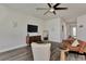 Living room with a brown couch and a large TV at 16257 S Port Harbor Blvd, Port Charlotte, FL 33953