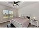 Bright bedroom with a queen-size bed and large window at 16257 S Port Harbor Blvd, Port Charlotte, FL 33953