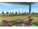 Relaxing patio with seating and backyard view at 16257 S Port Harbor Blvd, Port Charlotte, FL 33953