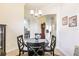 Cozy dining area featuring a round table and four chairs at 2224 Lynx Run, North Port, FL 34288