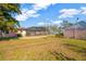 Backyard view with screened patio and partial house view at 2412 Crescent E Ct, Bradenton, FL 34208