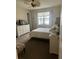 Spacious bedroom with lake view, dresser, and ceiling fan at 2536 Marton Oak Blvd, North Port, FL 34289