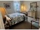 Bedroom with double bed, dresser, and decorative accents at 2536 Marton Oak Blvd, North Port, FL 34289
