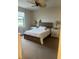 Cozy bedroom with a wooden bed frame and ample natural light at 2536 Marton Oak Blvd, North Port, FL 34289