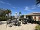 Relaxing community pool area with tables, umbrellas, and grills at 2536 Marton Oak Blvd, North Port, FL 34289