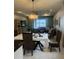 Spacious dining area with water views and living room access at 2536 Marton Oak Blvd, North Port, FL 34289