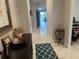 View of living area from entryway with teal rug at 2536 Marton Oak Blvd, North Port, FL 34289