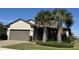 Single-story home with two-car garage and landscaped yard at 2536 Marton Oak Blvd, North Port, FL 34289