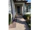 Welcoming front entry with brick walkway and landscaping at 2536 Marton Oak Blvd, North Port, FL 34289