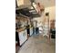 Well-maintained garage with overhead storage and shelving at 2536 Marton Oak Blvd, North Port, FL 34289