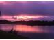 Stunning sunset view over a serene lake at 2536 Marton Oak Blvd, North Port, FL 34289