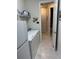 Laundry room with washer, dryer, and storage at 2536 Marton Oak Blvd, North Port, FL 34289
