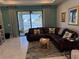 Living room with sectional sofa, water view, and plenty of natural light at 2536 Marton Oak Blvd, North Port, FL 34289
