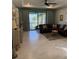 Living area with comfortable seating and a view of the lake at 2536 Marton Oak Blvd, North Port, FL 34289