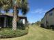 Side yard with grass and view of neighboring homes at 2536 Marton Oak Blvd, North Port, FL 34289