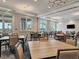 Elegant clubhouse dining room with large tables at 25532 Royal Tern Ln, Englewood, FL 34223