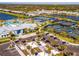 Aerial view of community amenities, including pool, tennis courts, and clubhouse at 25917 Bimini Sands Ct, Englewood, FL 34223