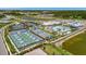 Community overview with tennis and pickleball courts, pool, and lake at 25917 Bimini Sands Ct, Englewood, FL 34223