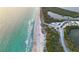 Aerial view of beach with people and parking at 25917 Bimini Sands Ct, Englewood, FL 34223