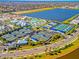 Community overview with tennis, pickleball courts, pool, and lake at 25917 Bimini Sands Ct, Englewood, FL 34223