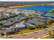 Community overview with tennis, pickleball courts, pool, and lake at 25917 Bimini Sands Ct, Englewood, FL 34223