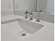 Modern bathroom sink and faucet with quartz countertop at 25917 Bimini Sands Ct, Englewood, FL 34223
