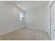 Simple bedroom with neutral walls and carpeted floor at 25917 Bimini Sands Ct, Englewood, FL 34223