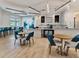 Clubhouse cafe with tables, chairs, and a coffee bar at 25917 Bimini Sands Ct, Englewood, FL 34223