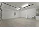 Spacious garage with ample storage space and a utility sink at 25917 Bimini Sands Ct, Englewood, FL 34223