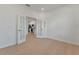 Bright office with French doors and view into kitchen area at 25917 Bimini Sands Ct, Englewood, FL 34223