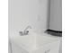 A laundry area with a sink and space for a washer and dryer at 25917 Bimini Sands Ct, Englewood, FL 34223