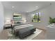 Main bedroom with plush carpet and a large window at 25917 Bimini Sands Ct, Englewood, FL 34223