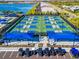 Expansive pickleball courts with many players enjoying a sunny day at 25917 Bimini Sands Ct, Englewood, FL 34223