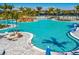 Relaxing resort-style pool with a rock waterfall feature at 25917 Bimini Sands Ct, Englewood, FL 34223