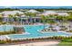 Large resort-style pool with plenty of lounge chairs and landscaping at 25917 Bimini Sands Ct, Englewood, FL 34223