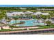 Aerial view of resort-style pool with surrounding lounge areas at 25917 Bimini Sands Ct, Englewood, FL 34223