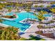 Luxury resort-style pool with ample lounge chairs and landscaping at 25917 Bimini Sands Ct, Englewood, FL 34223